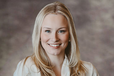 Professional portrait of Legal Assistant Kyleigh Stephens with blonde hair.