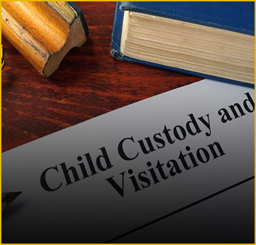 Legal documents and book for child custody and visitation.