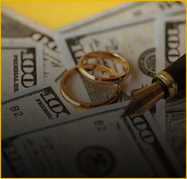 Wedding rings on hundred-dollar bills: Representing divorce.