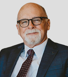 Headshot of Stuart Cearley, Esq., bald man with glasses and beard.