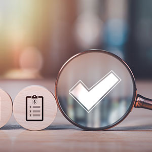 Magnifying glass on a checkmark, with a legal document icon, symbolizing proven legal results.