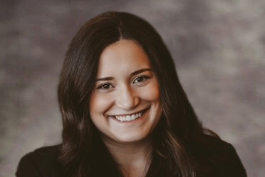 Professional headshot of Associate Attorney Eden Kinard in a dark blazer.