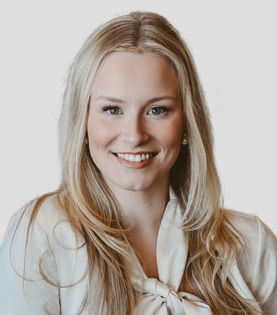 Professional portrait of Legal Assistant Kyleigh Stephens with blonde hair.