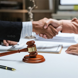 Business lawyer consulting with corporate client in office